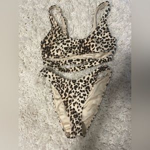This is a cheetah print bathing suit in a size extra small from Pacsun.